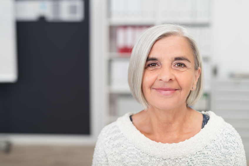 Gray Haired Office Woman Smiling at the Camera